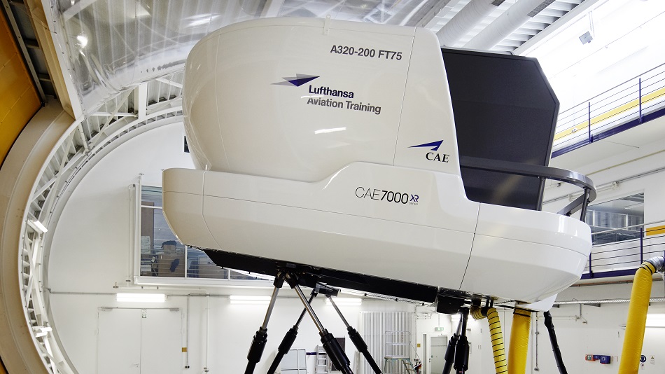 An A320 full-flight simulator in motion in a simulator hall.