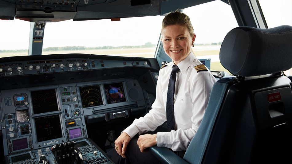 A co-pilot sits in the cockpit of an airplane.